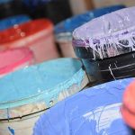 Image of large paint buckets with colorful paint - Learn about Dispersants for Electrostatic Stabilization in the Prospector Knowledge Center.