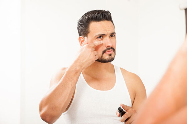 Man applying skin care product - learn how nanotechnology is being used in cosmetics in the Prospector Knowledge Center.