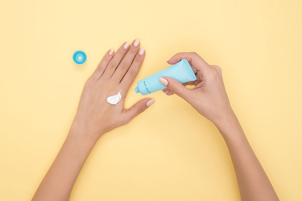 women's hands applying lotion - Learn more about Personal Care IP Trends