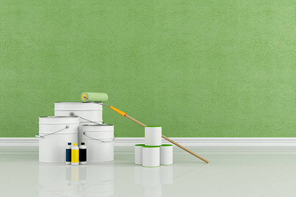 Green painted room with paint buckets - Learn more about Plant-based Additives for Greener Waterborne Coatings