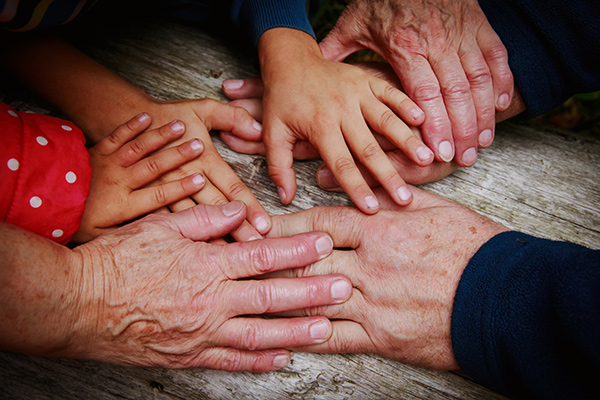 photo showing hands of people of different ages - Learn more about Cosmetic Applications of Genomics